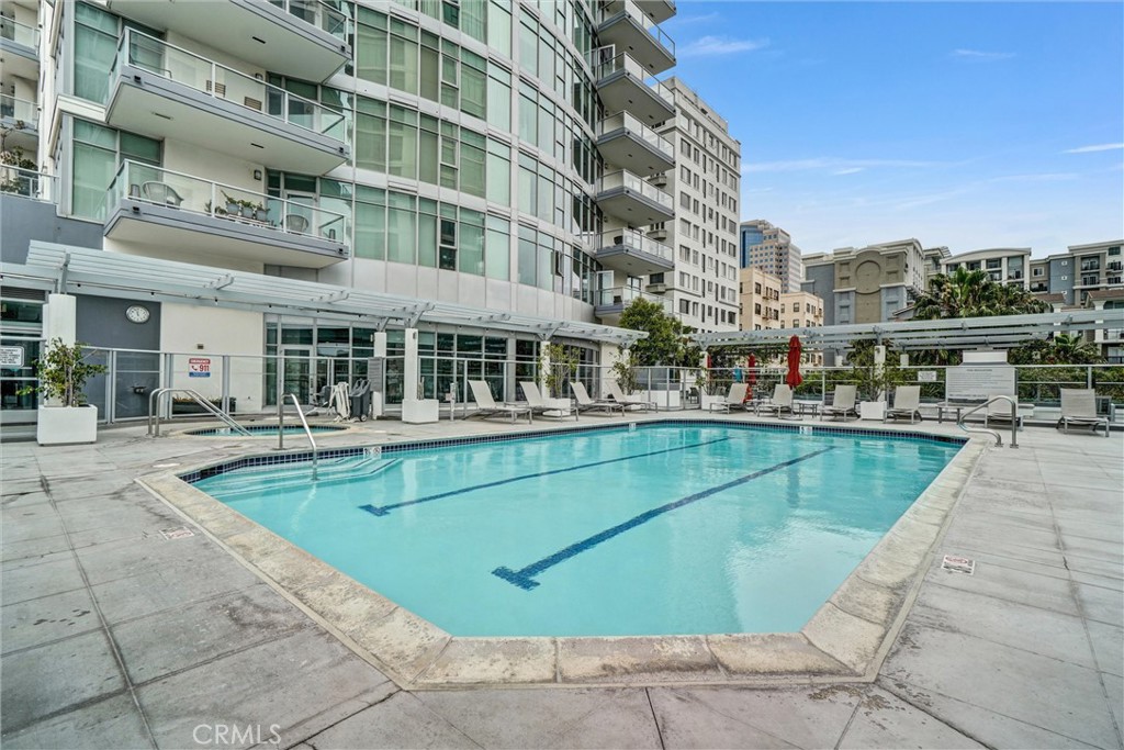 411 West Seaside Way, Unit 1804 Long Beach, CA 90802 - Photo 36 of 55 a view of a swimming pool with a lounge chairs