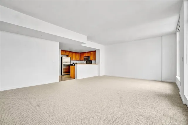 a kitchen with granite countertop a sink and stainless steel appliances