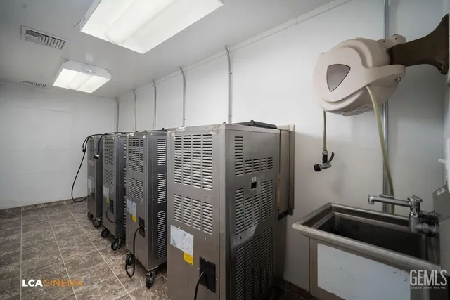 a kitchen with refrigerator and cabinets