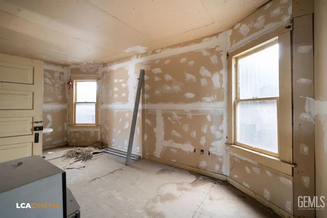 a bathroom with a toilet tub and shower