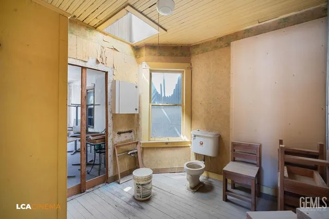 a bathroom with a toilet and shower