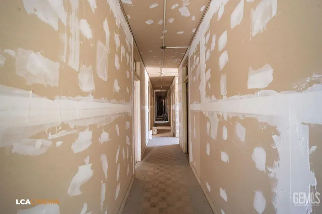 a bathroom with a shower and a sink