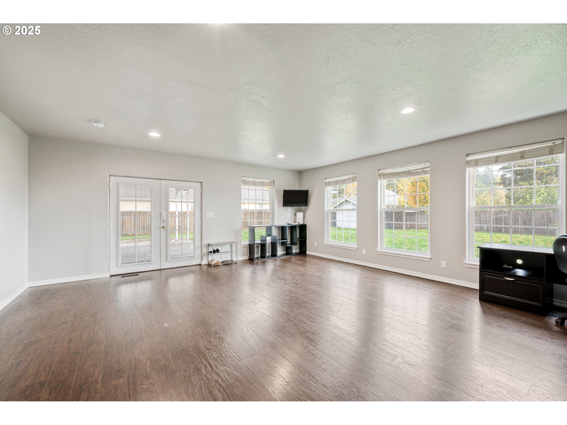 2770 48th Avenue Longview, WA 98632 - Photo 12 of 31 a view of an empty room with wooden floor and a window
