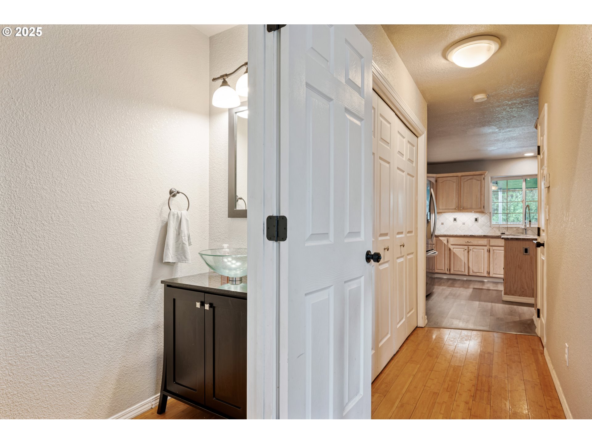 2770 48th Avenue Longview, WA 98632 - Photo 13 of 31 a bathroom with a sink and mirror