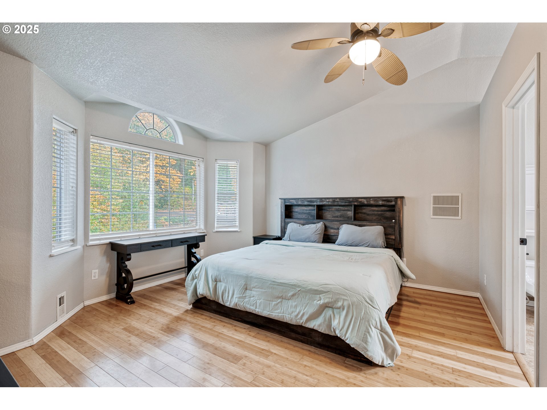 2770 48th Avenue Longview, WA 98632 - Photo 14 of 31 a bedroom with a bed and a large window