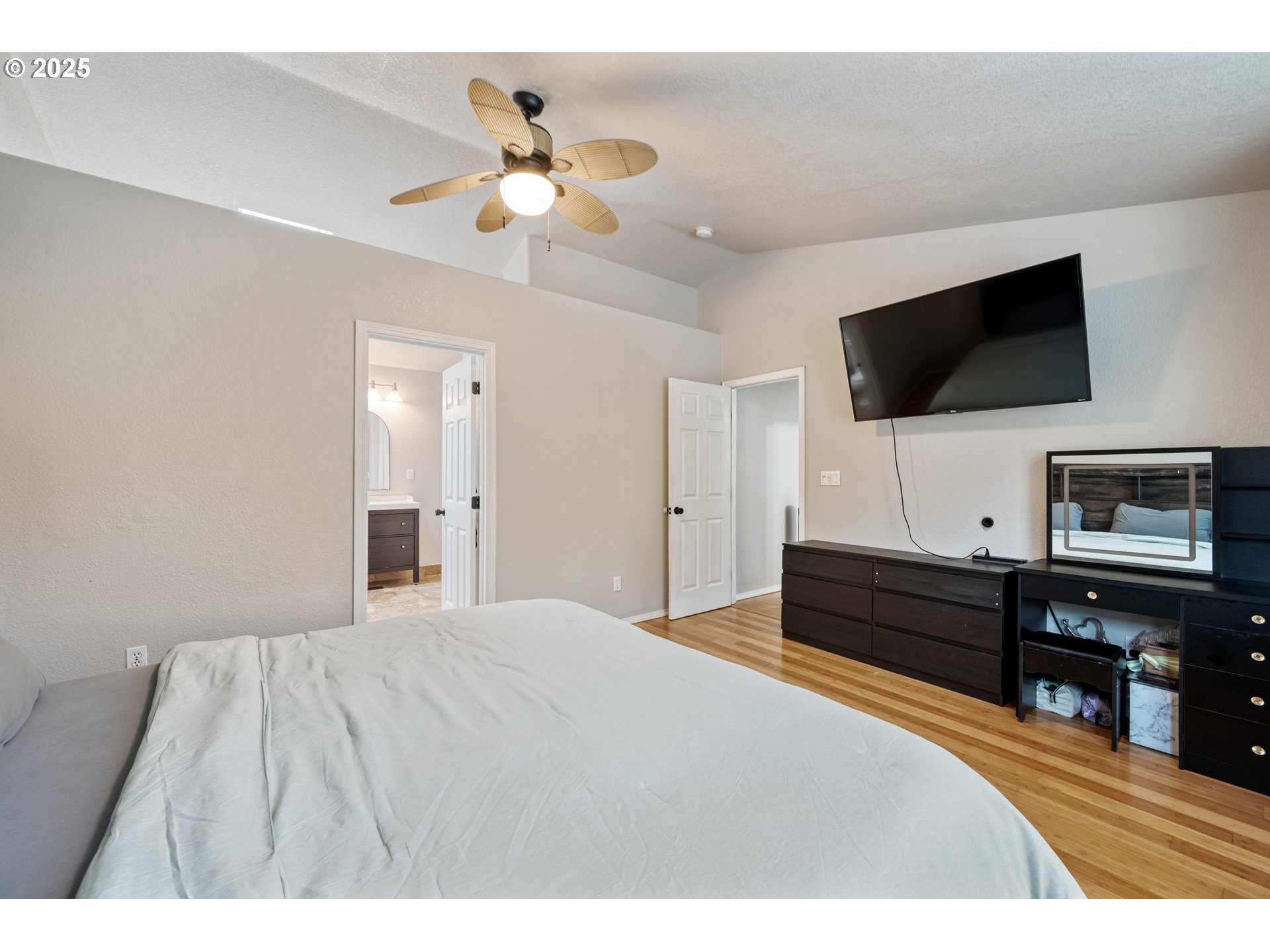 2770 48th Avenue Longview, WA 98632 - Photo 15 of 31 a bedroom with a bed and a flat screen tv
