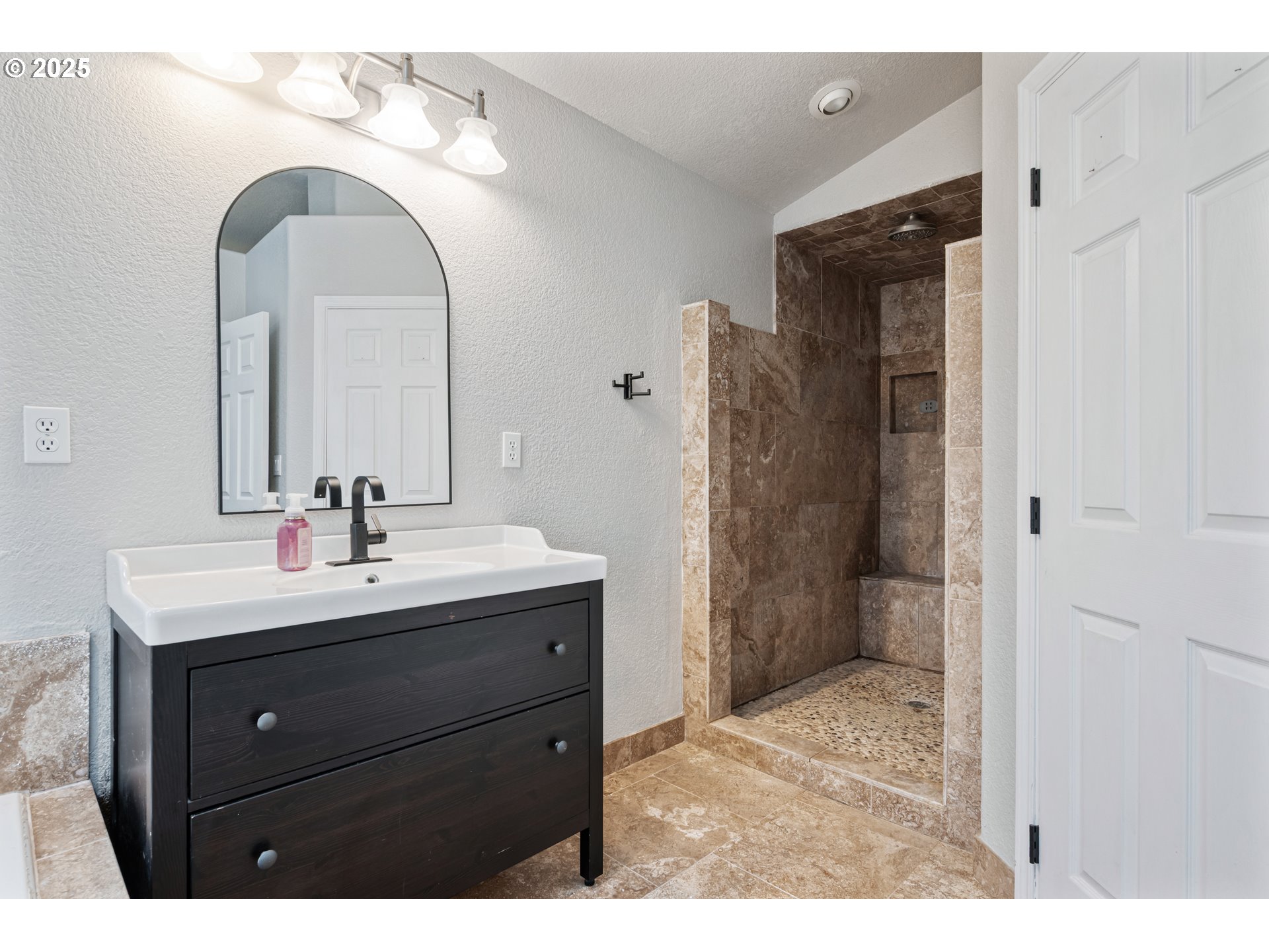 2770 48th Avenue Longview, WA 98632 - Photo 17 of 31 a bathroom with a sink and a mirror