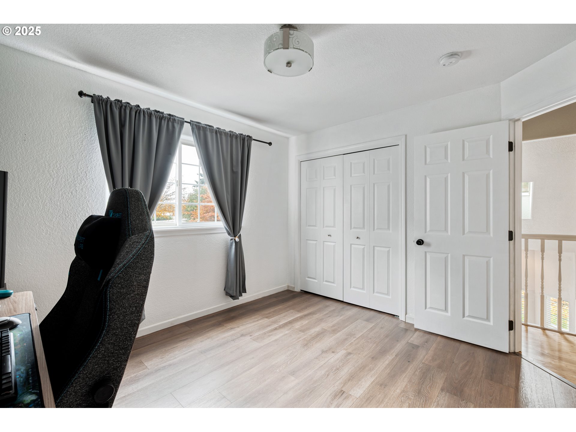 2770 48th Avenue Longview, WA 98632 - Photo 22 of 31 a view of an empty room with wooden floor and a window