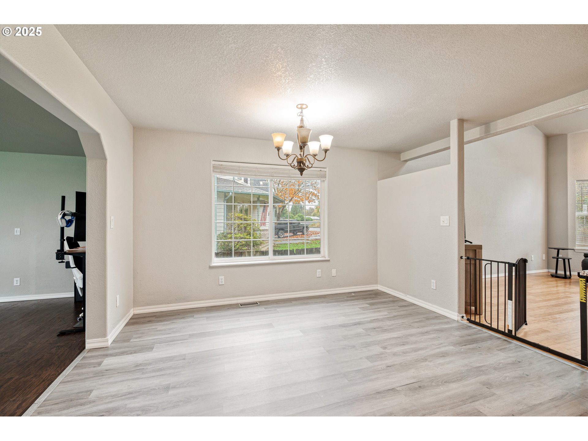 2770 48th Avenue Longview, WA 98632 - Photo 10 of 31 a view of an empty room with window and wooden floor