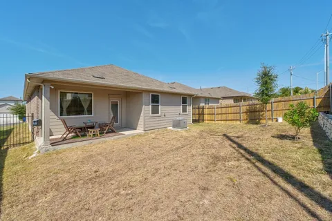 a view of a house with wooden floor and seating space