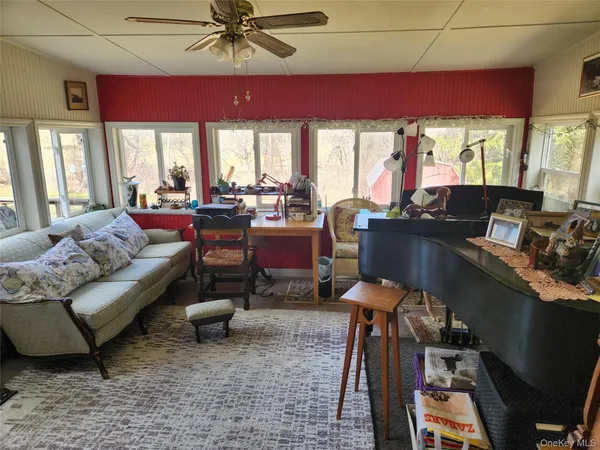 a living room with furniture and a large window
