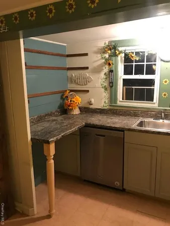 a kitchen with a sink and a microwave