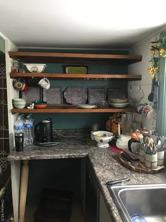 a kitchen with a stove and cabinets