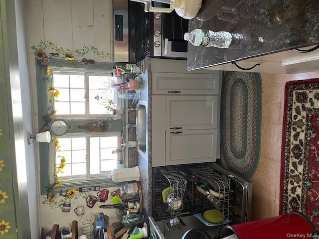 26 Bloody Hill Road Craryville, NY 12521 - Photo 10 of 18 a kitchen with a stove a sink and a window