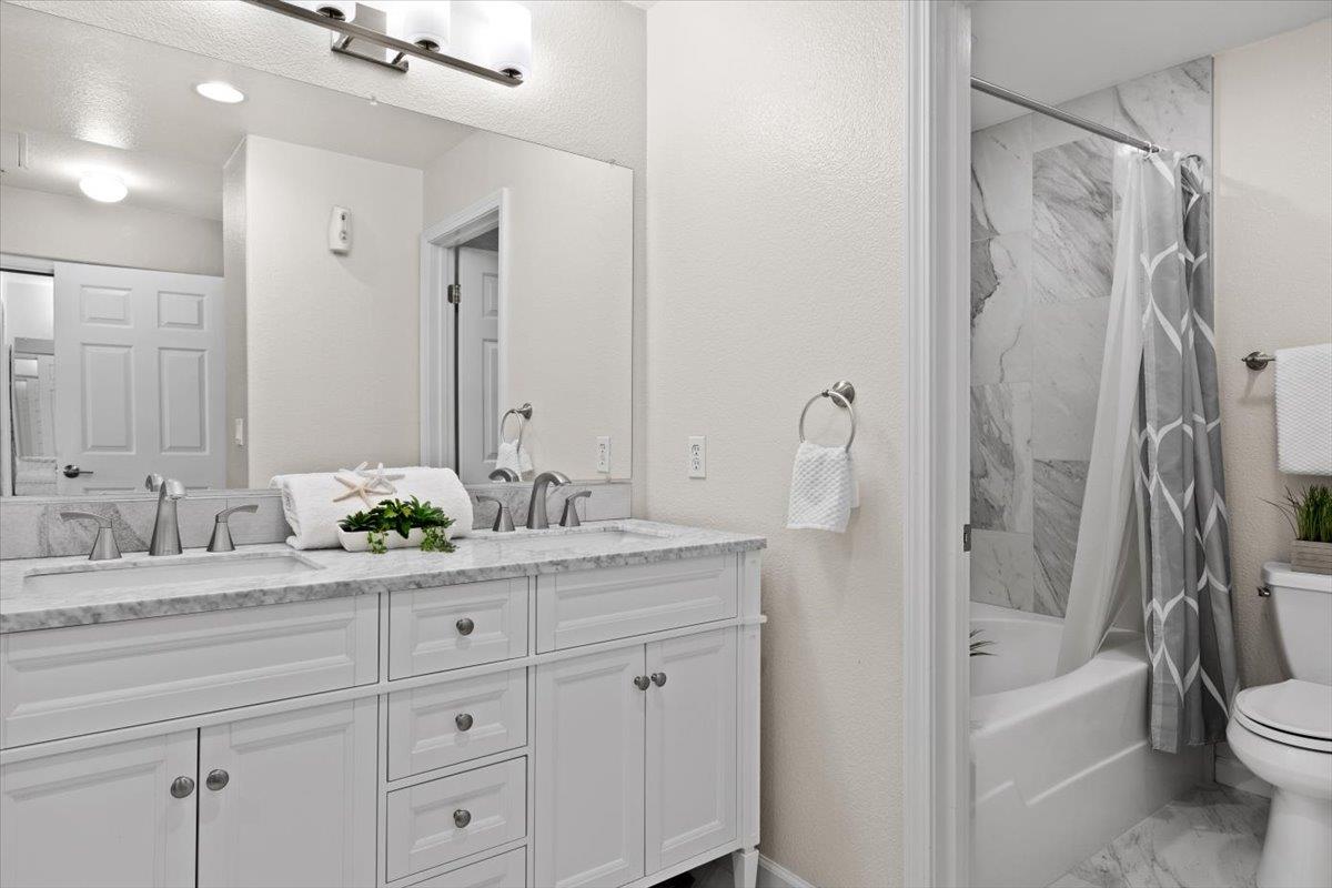467 Whitechapel Avenue San Jose, CA 95136 - Photo 11 of 34 a bathroom with a granite countertop sink a toilet and a bathtub