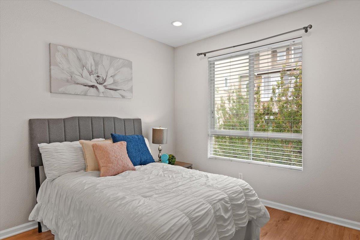 467 Whitechapel Avenue San Jose, CA 95136 - Photo 15 of 34 a bedroom with a bed and a painting on the wall