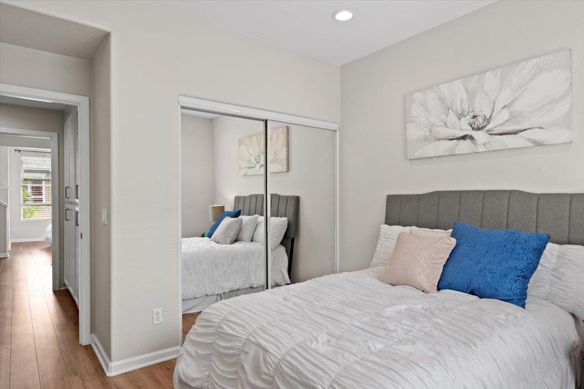 467 Whitechapel Avenue San Jose, CA 95136 - Photo 16 of 34 a bedroom with a bed and wooden floor