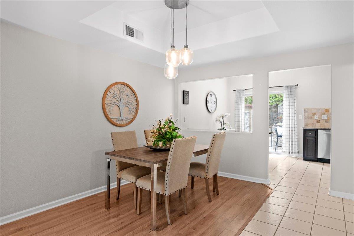 467 Whitechapel Avenue San Jose, CA 95136 - Photo 8 of 34 a view of a dining room with furniture a chandelier and wooden floor