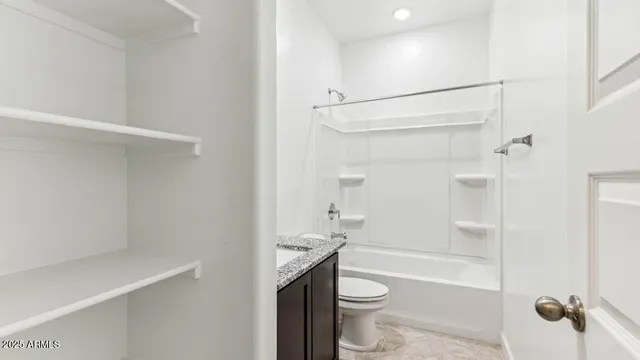 a view of a dining room with furniture and a chandelier