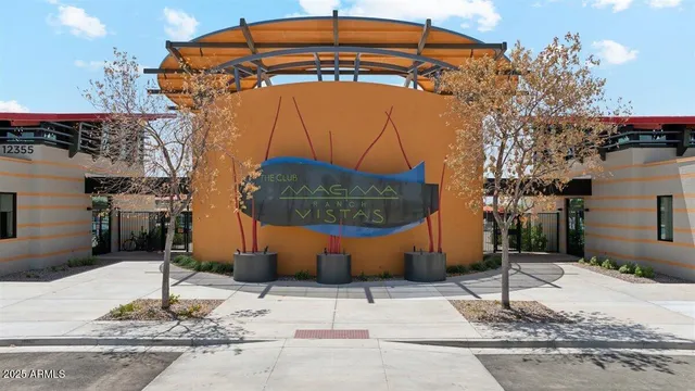 a view of a swimming pool with a patio and a slide