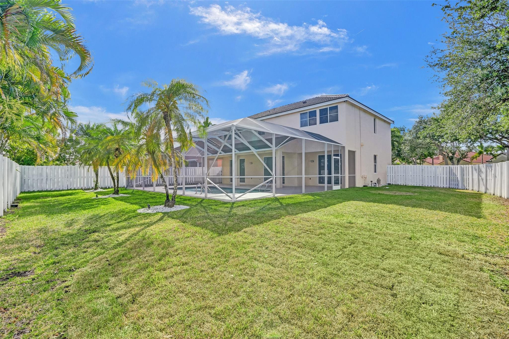 574 Slippery Rock Road Weston, FL 33327 - Photo 2 of 64 a front view of house with yard and green space