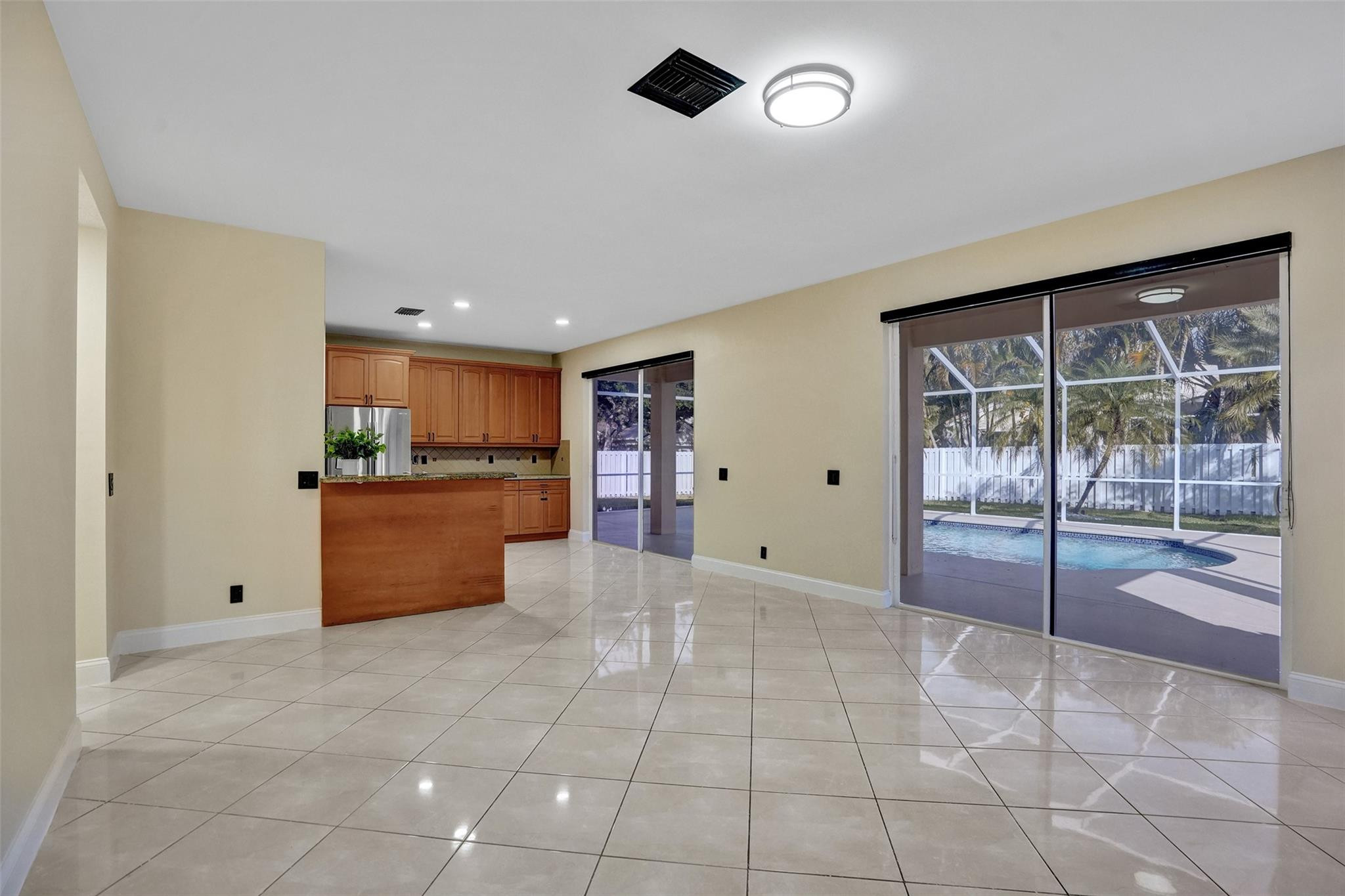 574 Slippery Rock Road Weston, FL 33327 - Photo 22 of 64 a view of kitchen with refrigerator and window