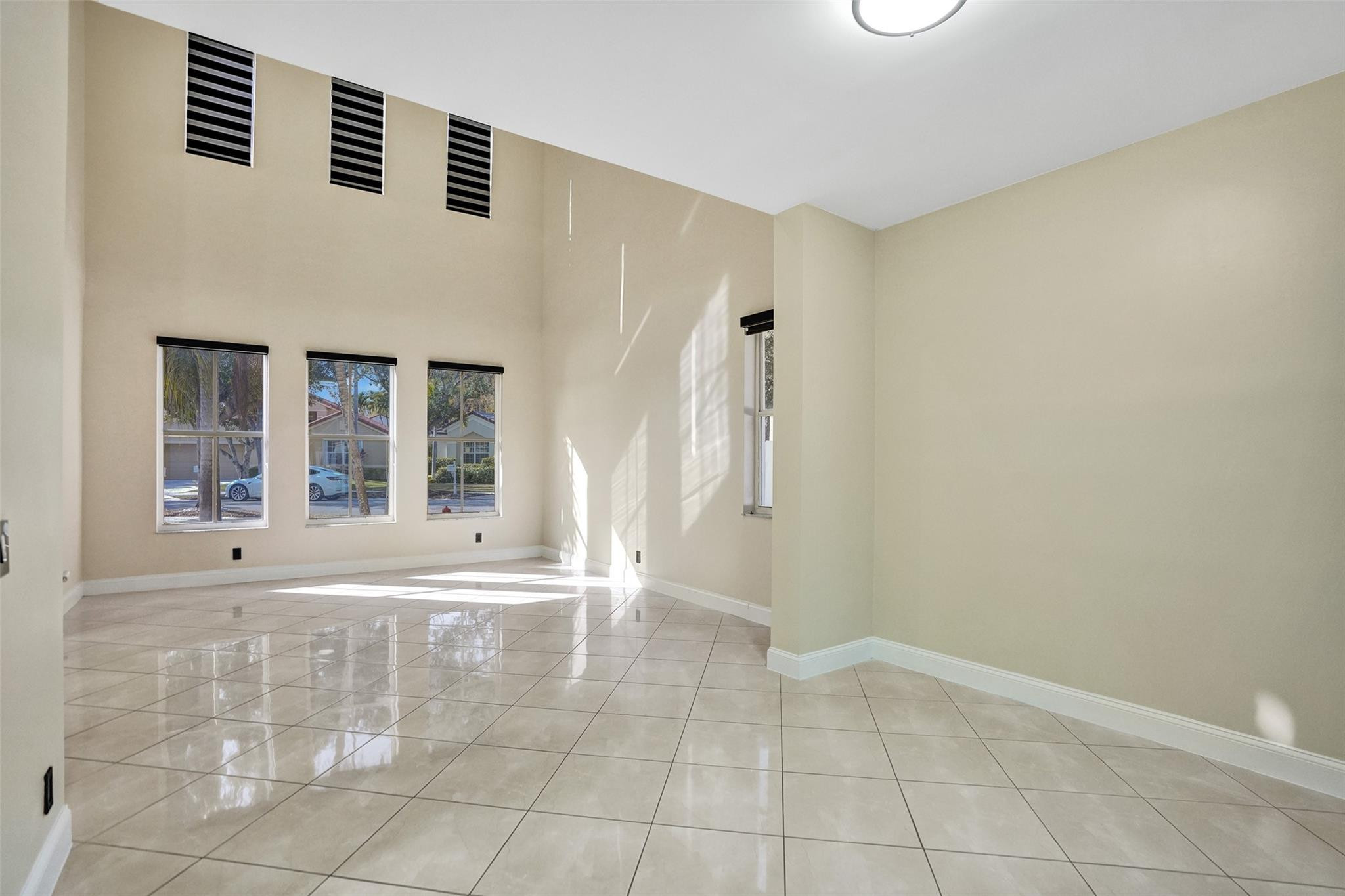 574 Slippery Rock Road Weston, FL 33327 - Photo 30 of 64 a view of an empty room with a window