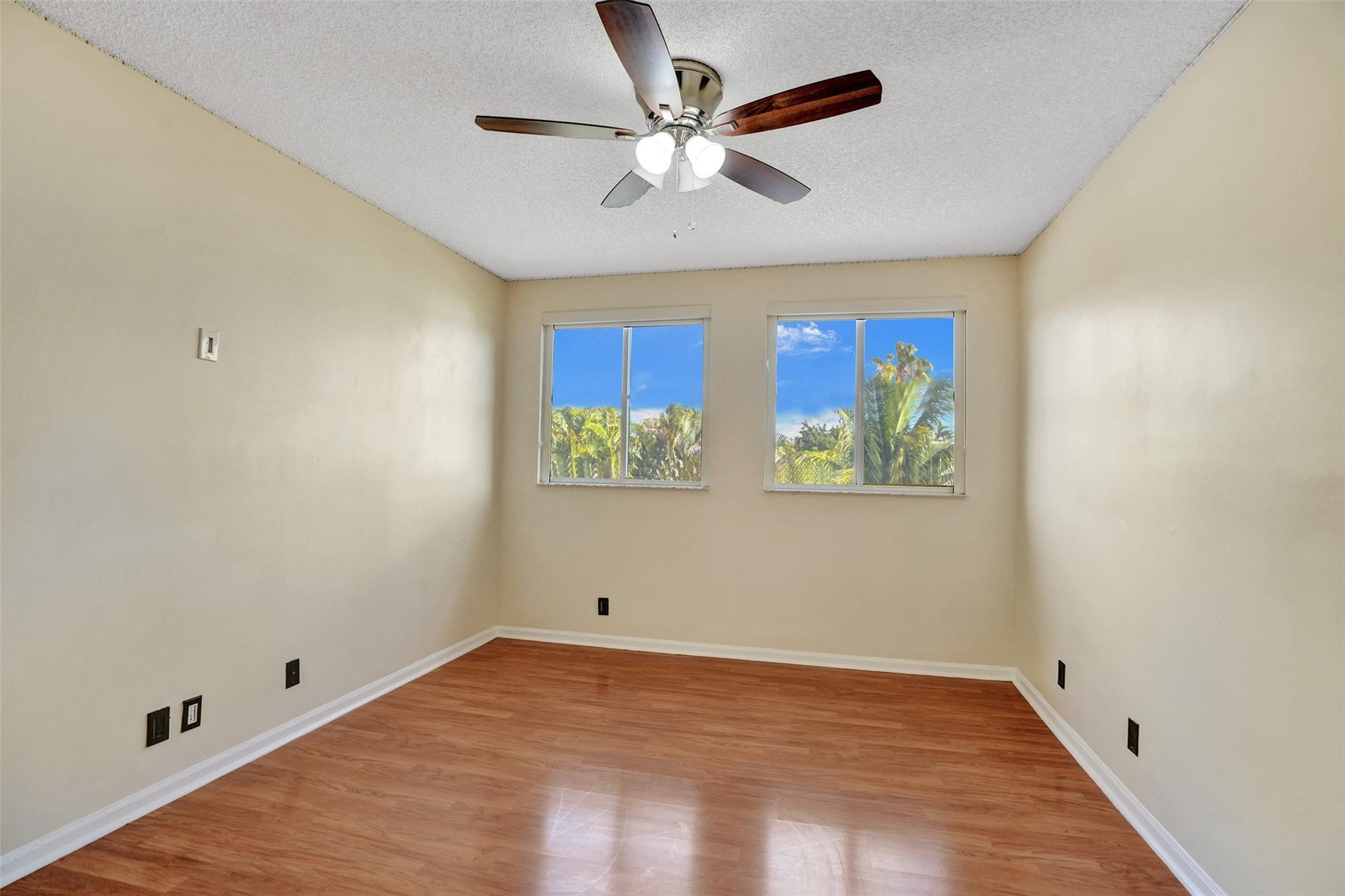 574 Slippery Rock Road Weston, FL 33327 - Photo 43 of 64 an empty room with windows and fan