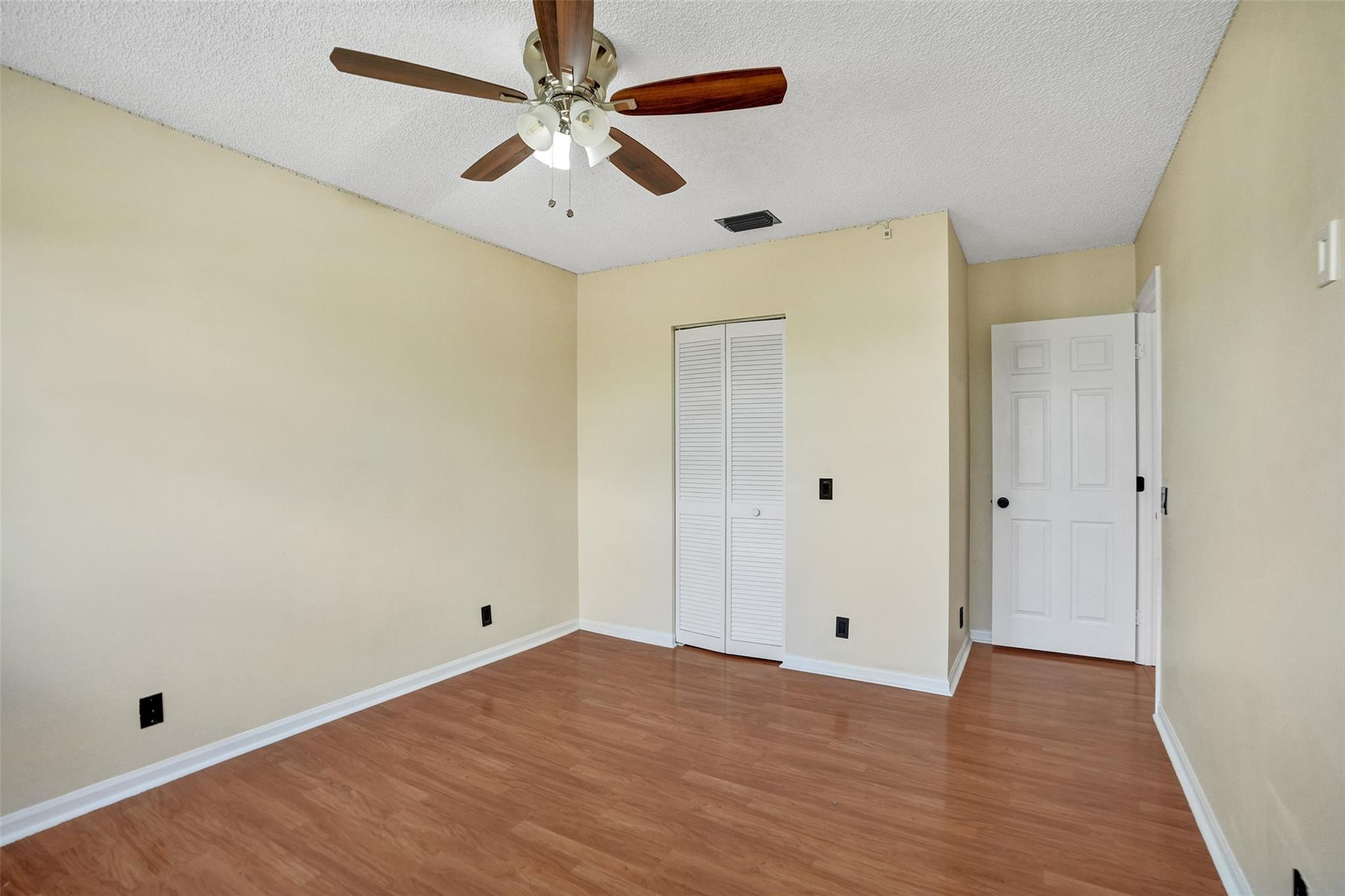 574 Slippery Rock Road Weston, FL 33327 - Photo 45 of 64 a view of an empty room and wooden floor