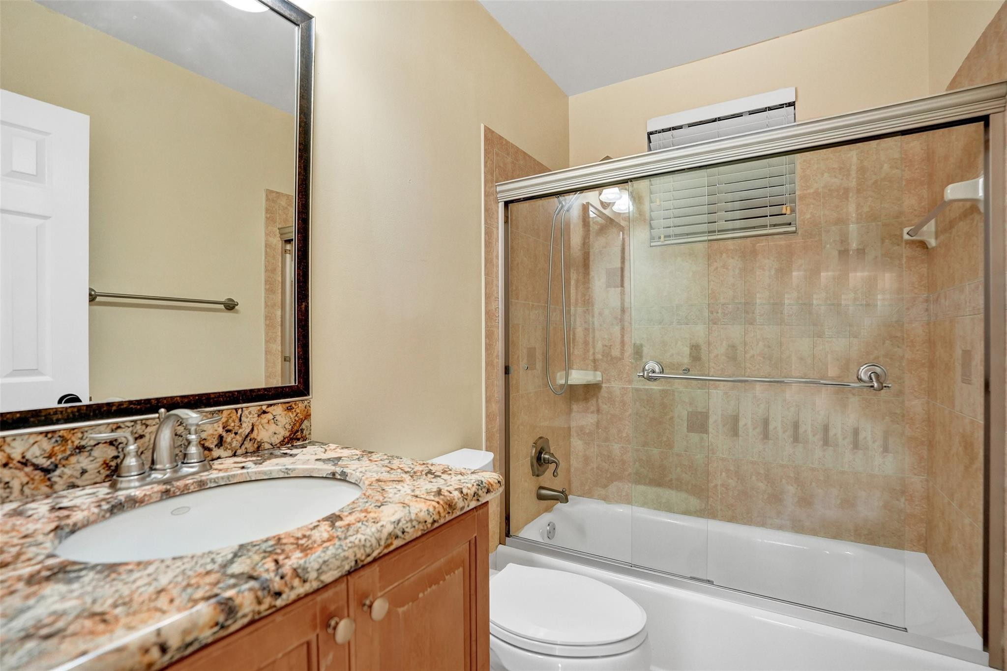 574 Slippery Rock Road Weston, FL 33327 - Photo 47 of 64 a bathroom with a granite countertop sink toilet and shower