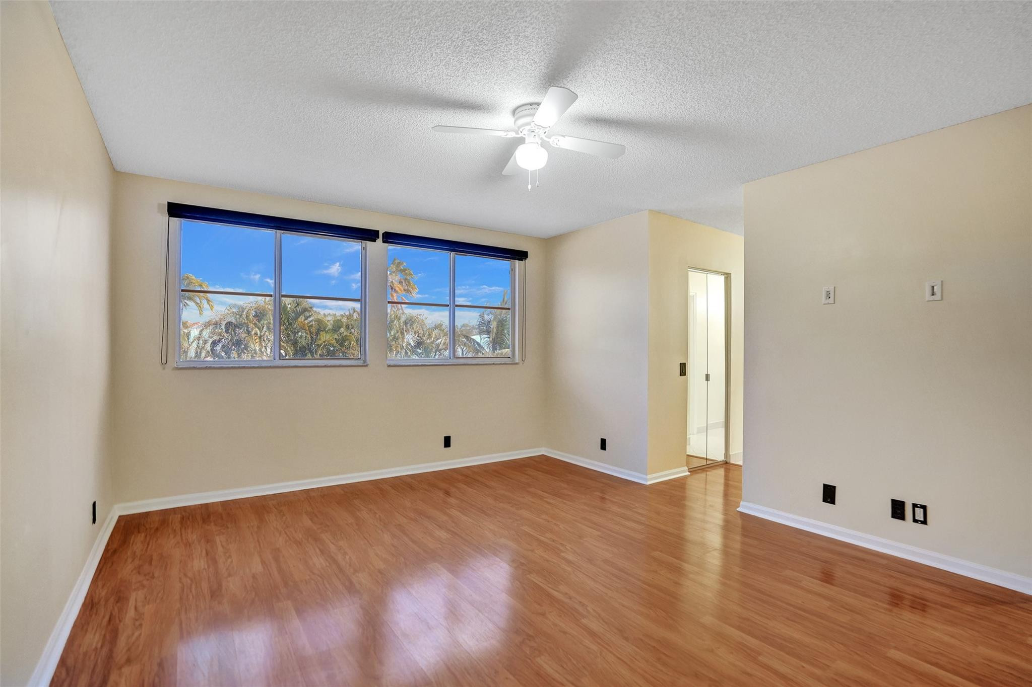 574 Slippery Rock Road Weston, FL 33327 - Photo 49 of 64 a view of a room with wooden floor and white walls