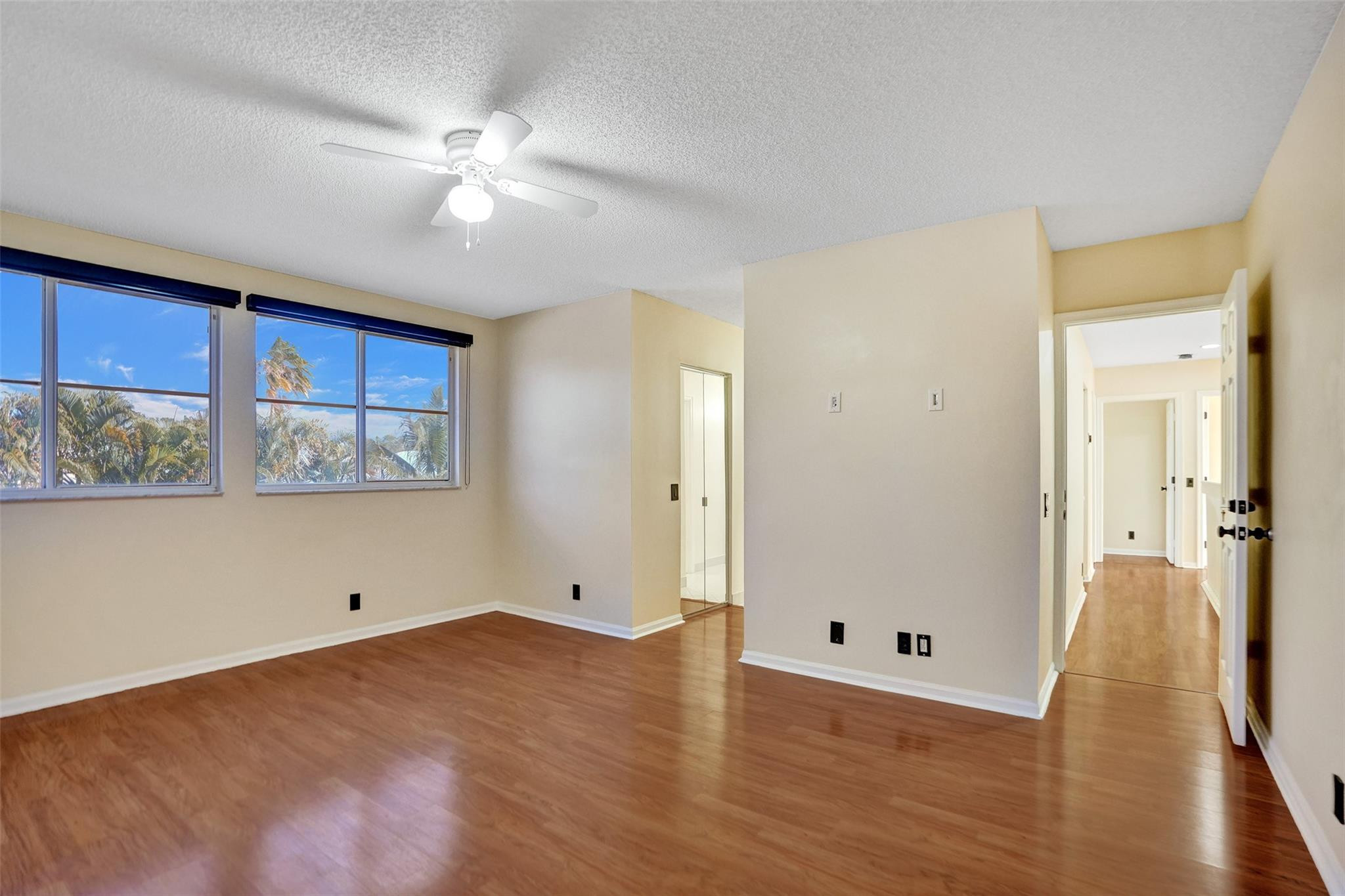 574 Slippery Rock Road Weston, FL 33327 - Photo 50 of 64 a view of an empty room with wooden floor and a window