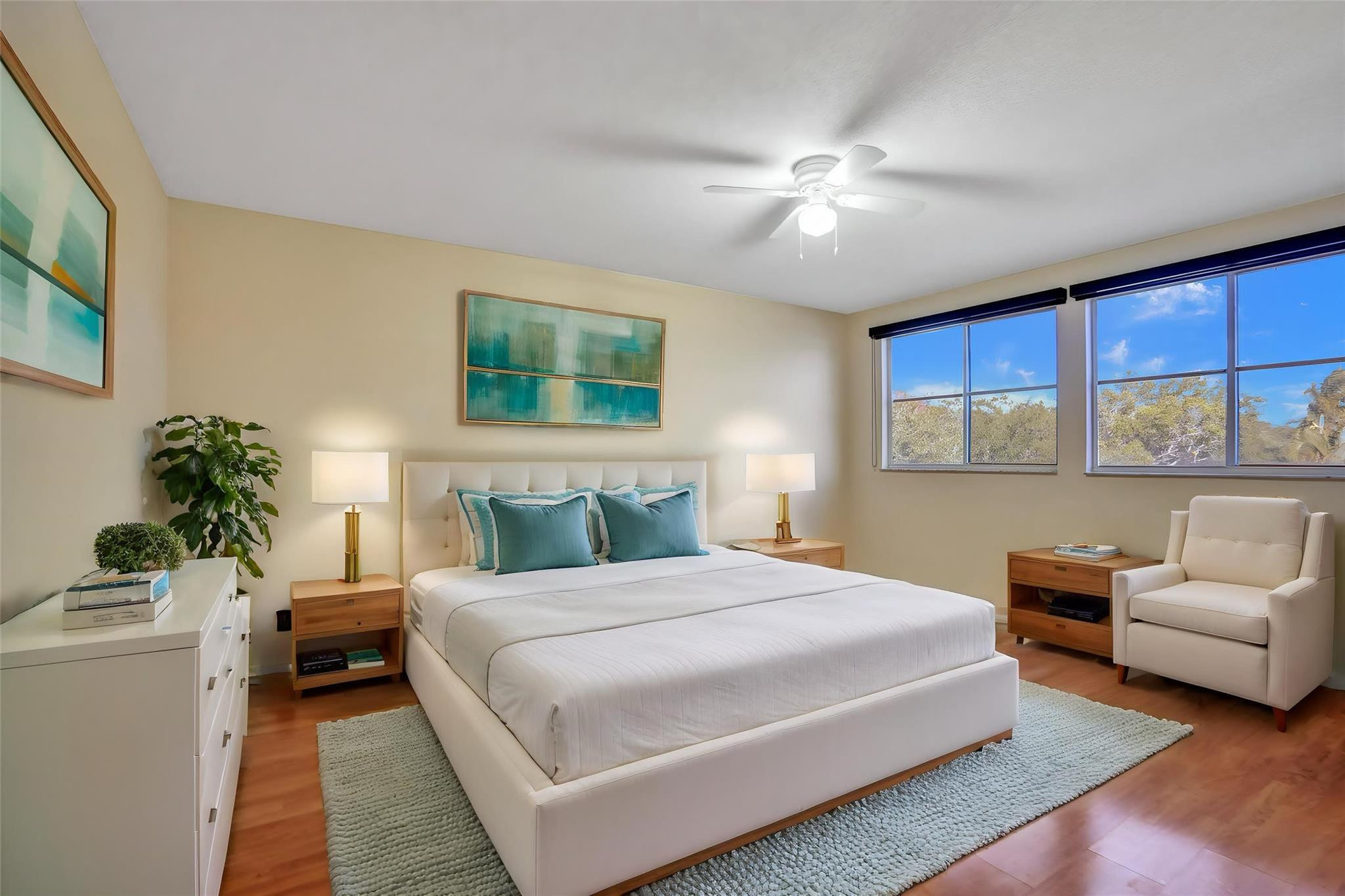 574 Slippery Rock Road Weston, FL 33327 - Photo 5 of 64 a bedroom with a large bed and a chandelier