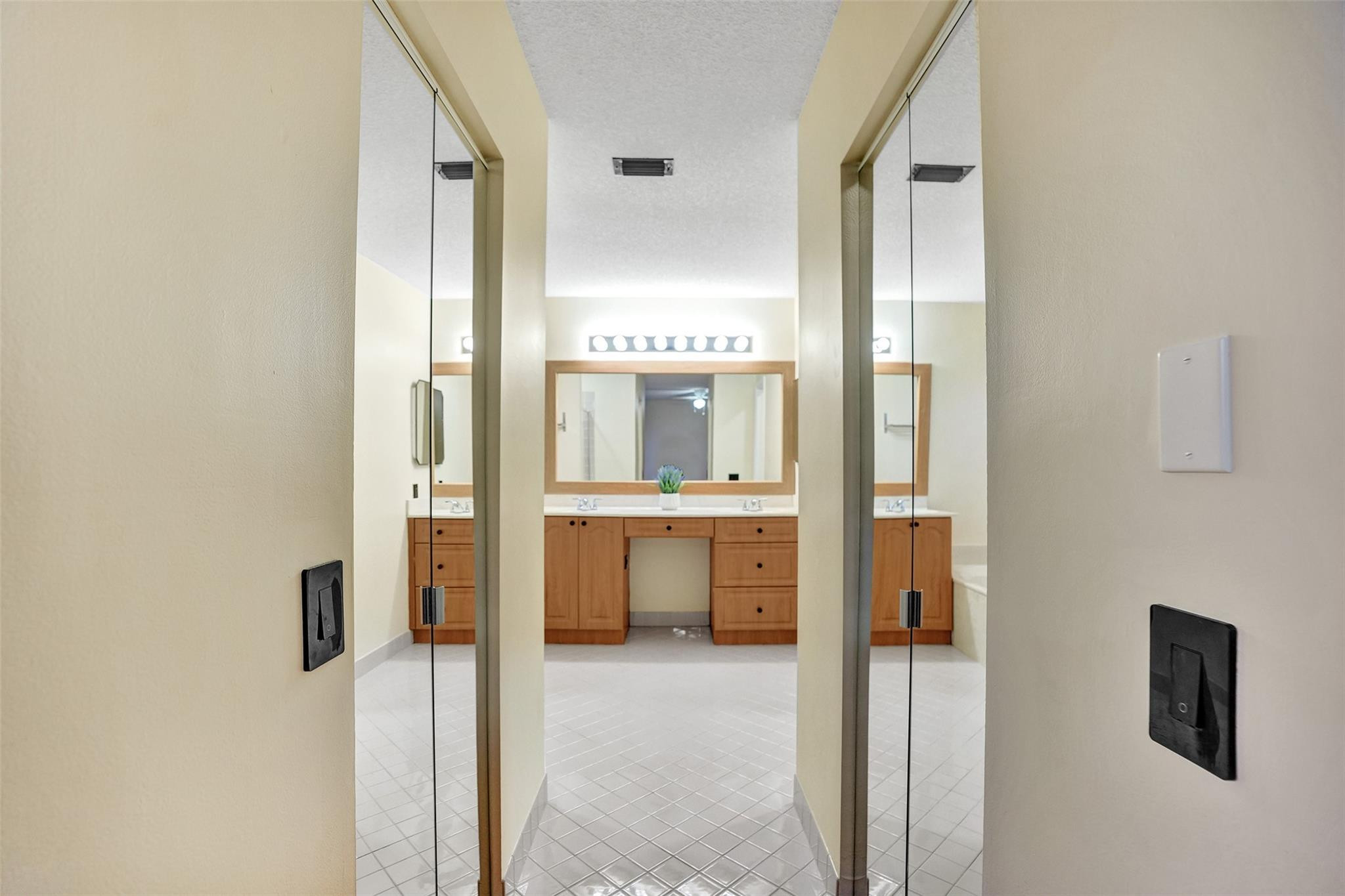 574 Slippery Rock Road Weston, FL 33327 - Photo 53 of 64 a bathroom with a tub and a view of living room