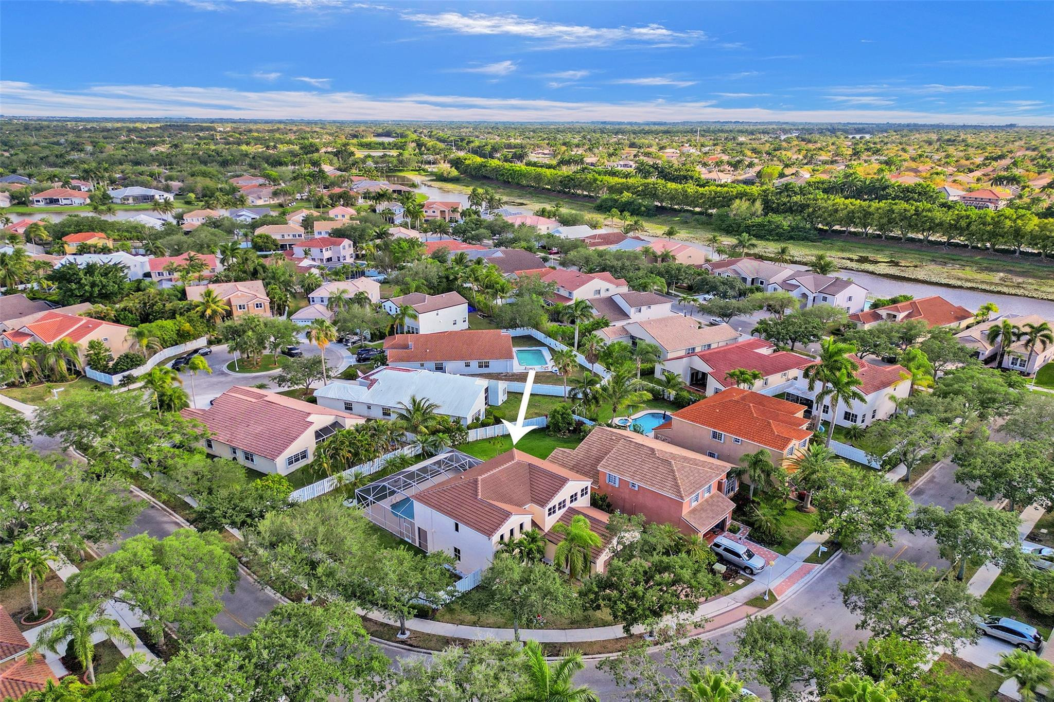 574 Slippery Rock Road Weston, FL 33327 - Photo 62 of 64 an aerial view of residential houses with outdoor space and ocean view