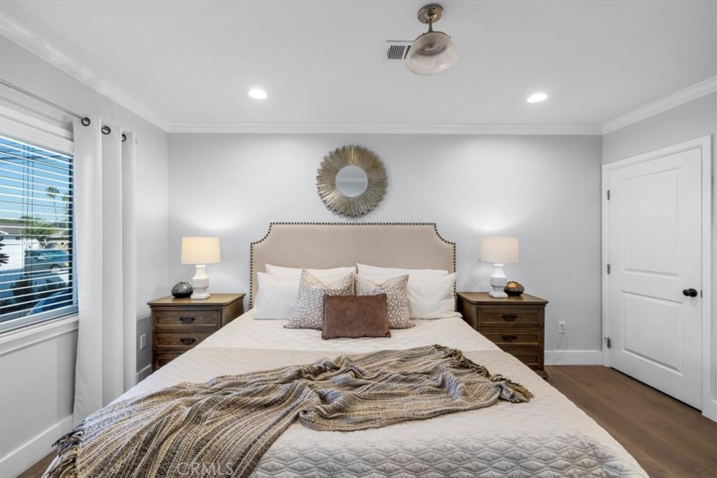 1416 11th Street Manhattan Beach, CA 90266 - Photo 14 of 28 a bedroom with a bed and wooden floor