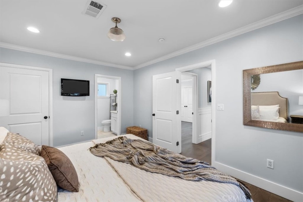 1416 11th Street Manhattan Beach, CA 90266 - Photo 15 of 28 a bedroom with a bed and a flat screen tv