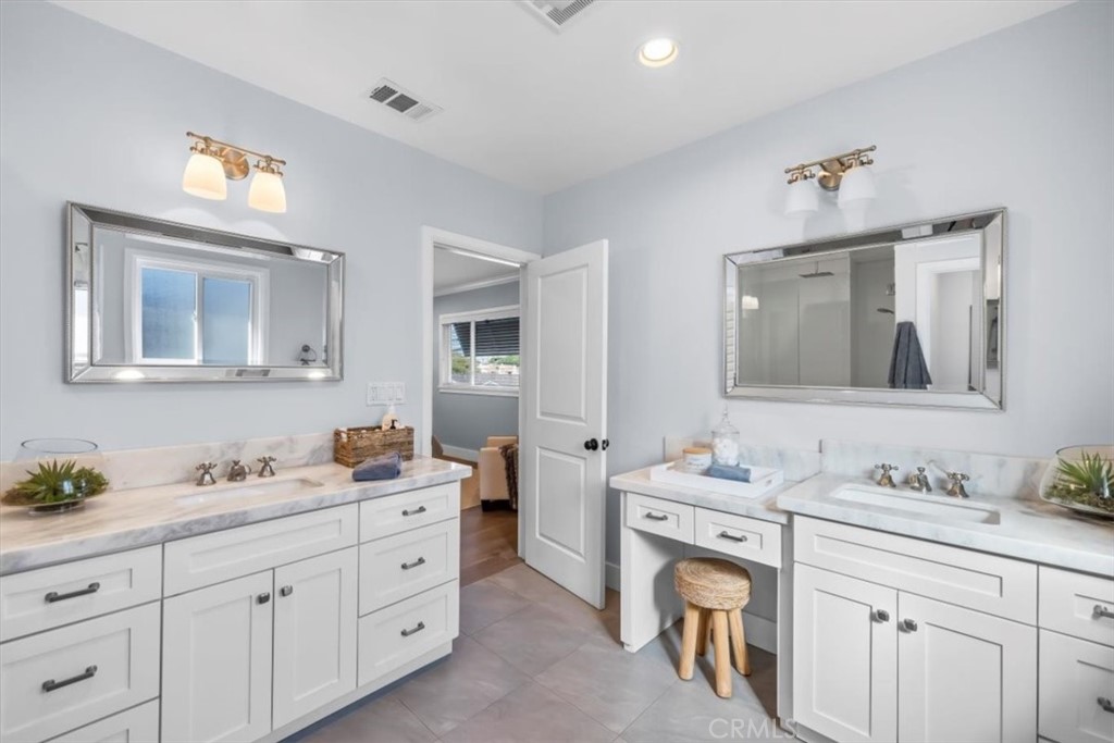1416 11th Street Manhattan Beach, CA 90266 - Photo 17 of 28 a bathroom with double sink and a mirror
