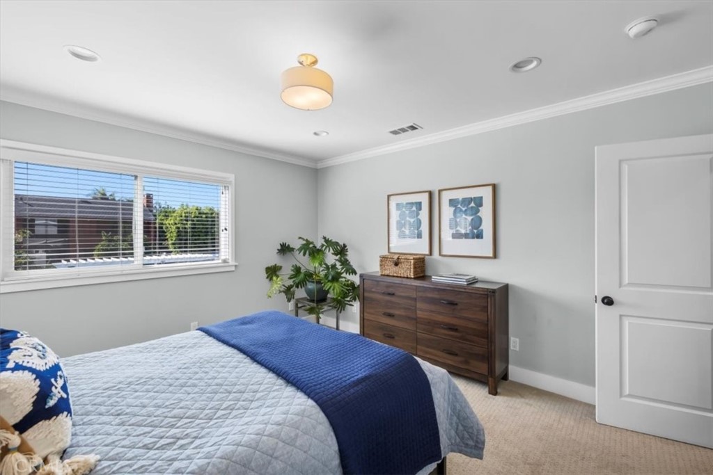 1416 11th Street Manhattan Beach, CA 90266 - Photo 19 of 28 a bedroom with a bed and window
