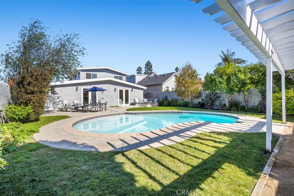 1416 11th Street Manhattan Beach, CA 90266 - Photo 23 of 28 a view of a house with swimming pool and yard