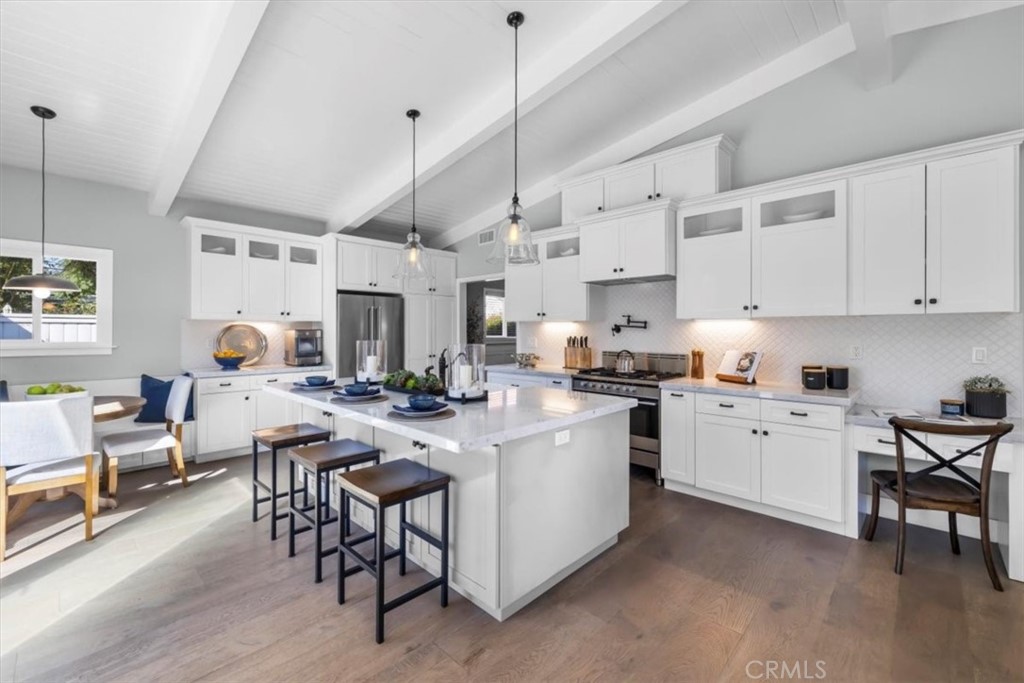 1416 11th Street Manhattan Beach, CA 90266 - Photo 4 of 28 a open dining room with kitchen island stainless steel appliances furniture cabinets and a wooden floor