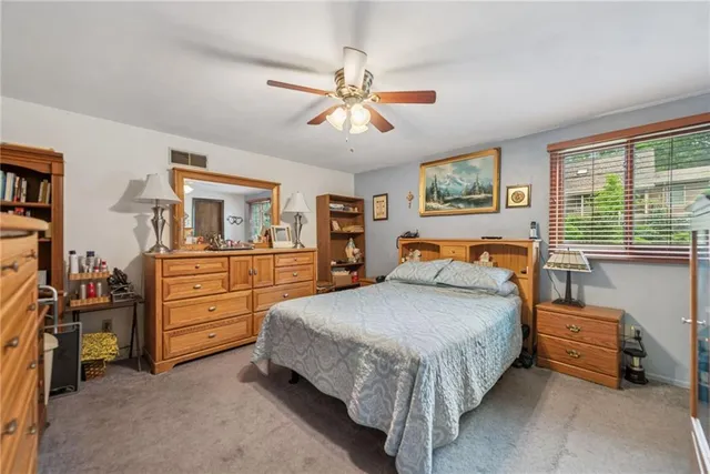 a bedroom with a bed and furniture