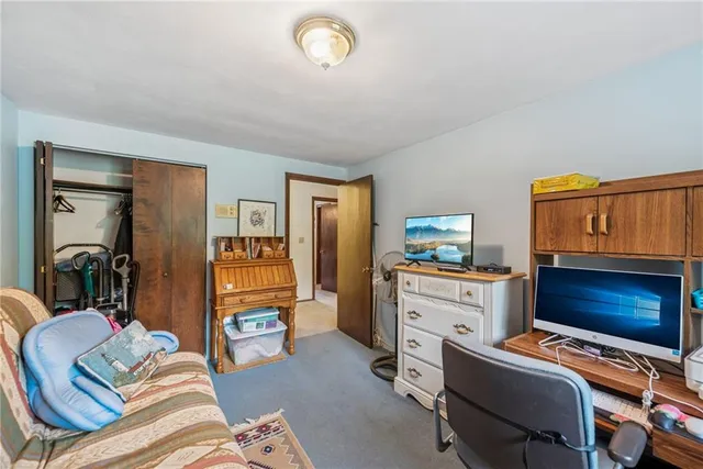 a bedroom with a bed and furniture