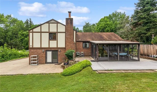a view of a house with a yard porch and sitting area