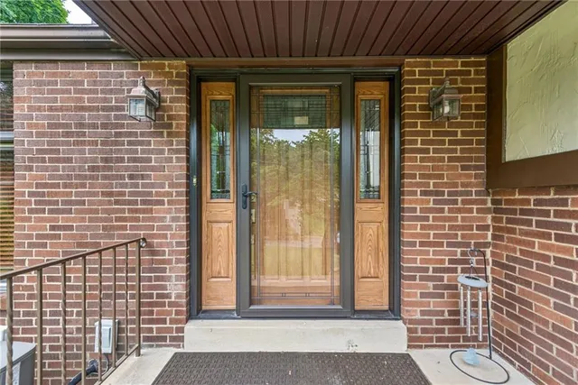 a view of a door and a window