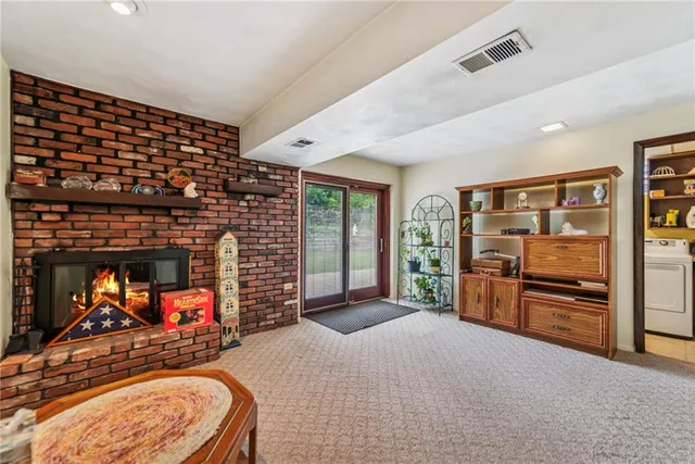 a bedroom with furniture and a fireplace