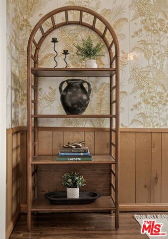 a kitchen with a sink and a potted plant