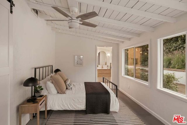 a view of a walk in closet and bathroom