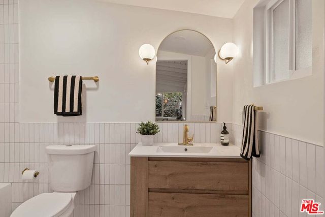 a view of a porch with a floor to ceiling window next to a yard