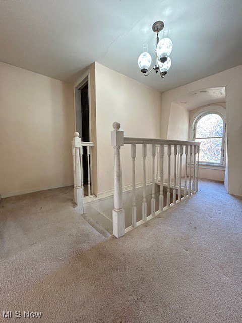 6128 Riverview Road Peninsula, OH 44264 - Photo 12 of 17 Hallway with carpet and a chandelier